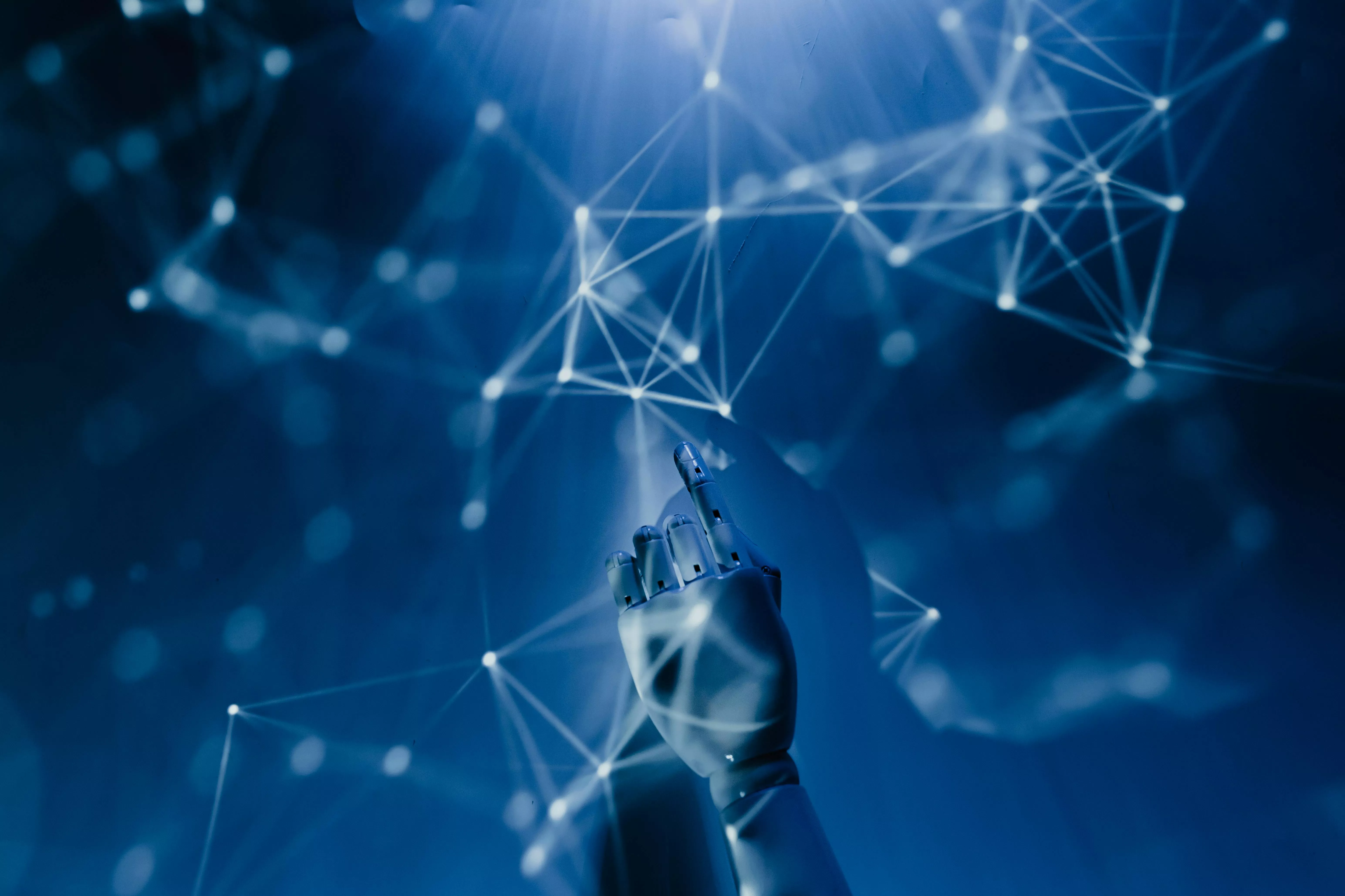Stock image - robot hand touching light mesh