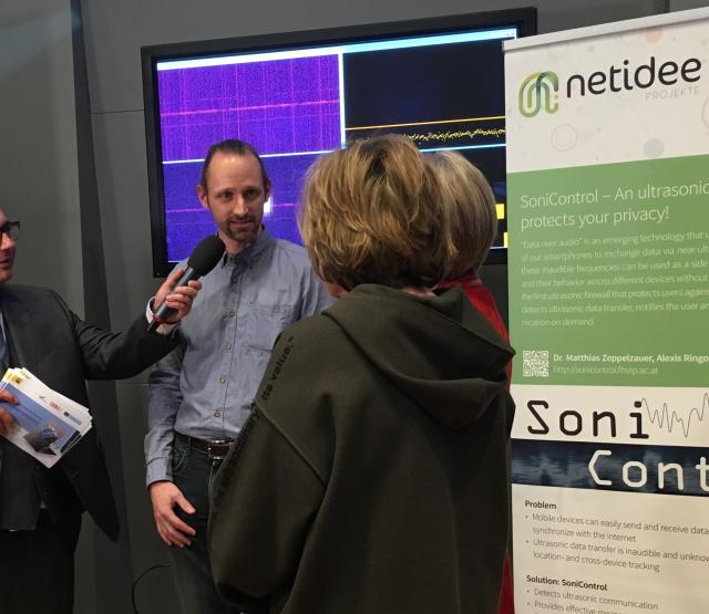 Discussion at SoniControl booth