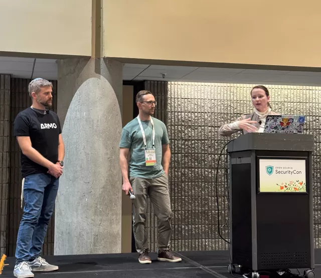 The three maintainers on stage together