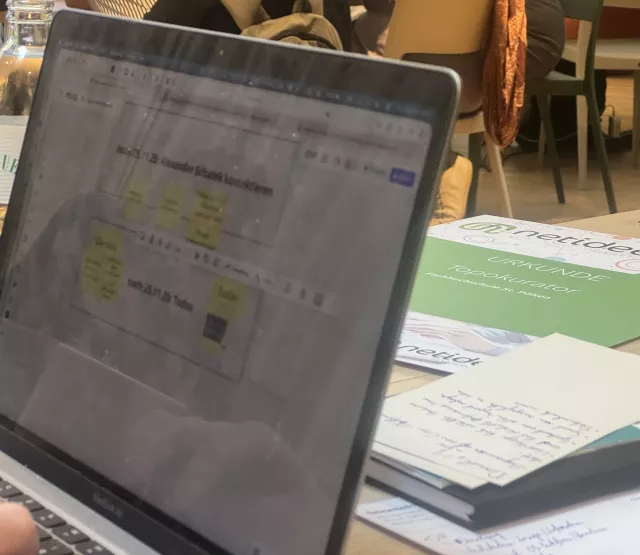 a laptop screen showing a first project draft