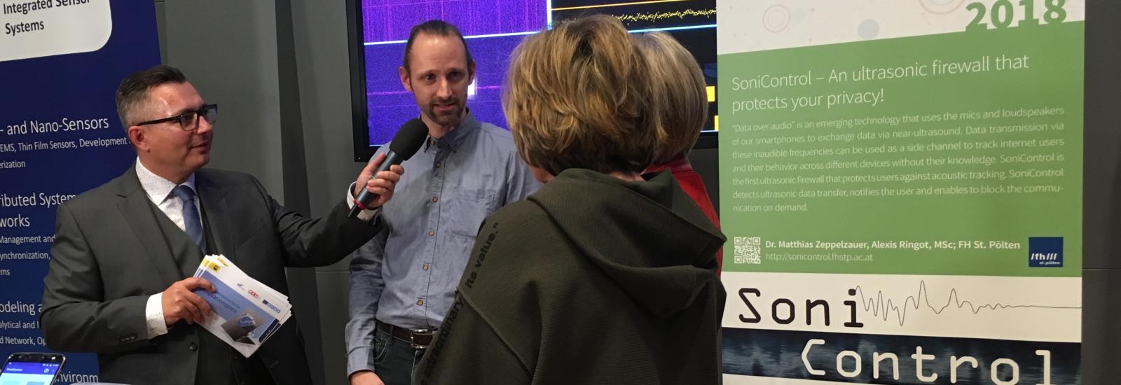 Discussion at SoniControl booth