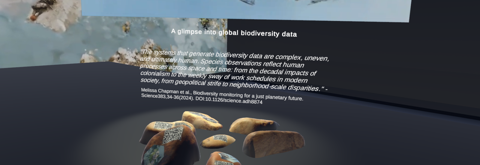 A digital exhibition display showcasing a theme on global biodiversity data. In the center, there is a floating image of a globe with a hazy, semi-transparent texture, appearing to represent biodiversity. Below the globe, a quote discusses the complexity and human influence on biodiversity data. The exhibition is set in a dark, immersive virtual space.